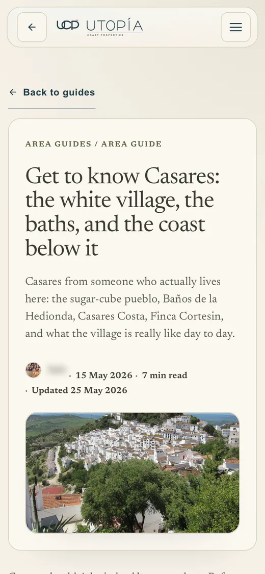 The Casares area guide on a phone: the white village, the baths and the coast below it